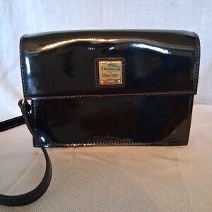 Dooney and Bourke Black. Patent leather. Small shoulder bag. 8 by 6.